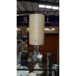 A vintage glass table lamp with fibreglass shade