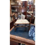 An Edwardian carver chair