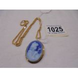 A Venetian glass cameo in an 18ct gold mount with attached 18ct gold chain, 9.3 grams.