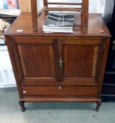 A modern solid wood TV cabinet. Opening doors over drop down front. Collect Only.