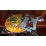 2 picture discs - Tina Turner 'Break Every Rule' cut out with stand (45) and Amanda Lead 'Never