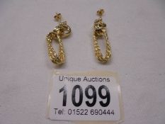 A pair of 9ct gold earrings, size 3.4 grams.