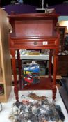 A dark wood stained side table with drawer & gallery top