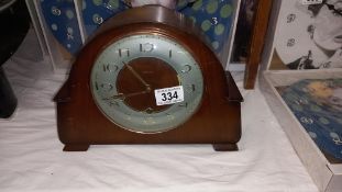 A 1930's oak mantle clock