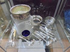 A mixed lot of silver plate including wine coaster, dishes, flatware etc.,
