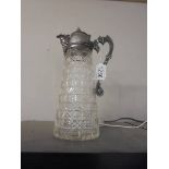 A hobnail cut glass claret jug with mask spout. A/F 2 chips on bottom rim