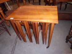 A nest of teak tables. COLLECT ONLY