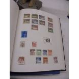 Two albums of stamps including German.