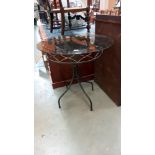 A smoked glass top wrought iron garden table, COLLECT ONLY