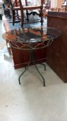 A smoked glass top wrought iron garden table, COLLECT ONLY