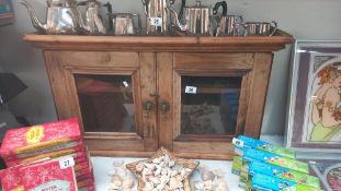 An antique pine wall cupboard with glazed doors COLLECT ONLY