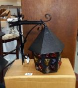 An unused vintage boxed Da Vinci Pebble outside lantern with multi-coloured glass and wrought iron