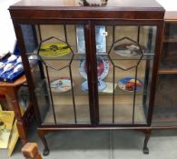 An Edwardian mahogany display cabinet with astragal glazed doors, 1 pane of glass is a/f
