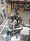 A bronze figure of a Rodeo Cowboy on a horse, base 9 x 5 cm, total height 12 cm.