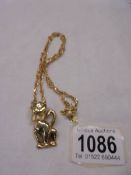 A 9ct gold cat pendant on a 9ct gold chain, 10.5 grams.