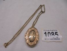 A 9ct gold locket on a 9ct gold chain, 12 grams.