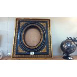 A 'Carvers and Gilders' ormalu and black picture frame 45cm x 50cm, oval 19cm x 24cm COLLECT ONLY