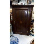 A 19c oak corner cupboard with inlaid door and dentil cornice COLLECT ONLY