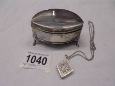 A silver trinket pot (hinge needs repair) and a silver picture box pendant on chain.
