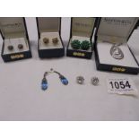 A silver pendant, three pairs of silver earrings (1 missing clips) & two other pairs of earrings,