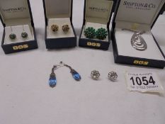 A silver pendant, three pairs of silver earrings (1 missing clips) & two other pairs of earrings,