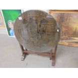 A heavily carved oriental tip top table with glass top. COLLECT ONLY.