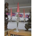 A silver plate candelabra.