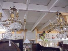 A pair of glass chandeliers in need of restoration. COLLECT ONLY.