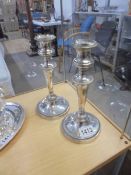 A pair of silver plate candlesticks.