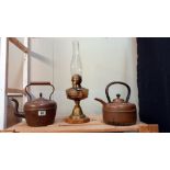 2 copper kettles and an oil lamp