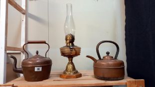 2 copper kettles and an oil lamp