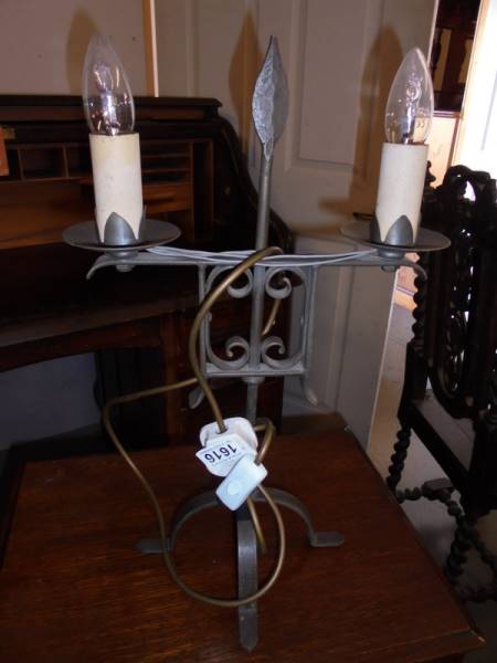 A two light metal table lamp.