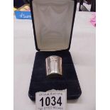 A cased hall marked silver whisky measure.