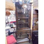 An oak glazed cabinet on stand COLLECT ONLY.