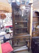 An oak glazed cabinet on stand COLLECT ONLY.