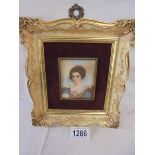 A gilt framed miniature portrait of an Eliizabethan lady.