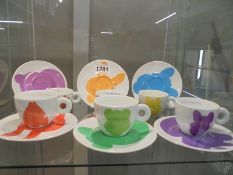 A set of six Jeff Koons Illy collection Rosenthal coffee cups and saucers (one saucer a/f).