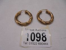 A pair of 9ct gold earrings, size 3.1 grams.