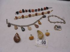A mixed lot of natural stone bracelets, pendants and earrings etc.,