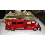 A large pressed steel and fibre glass model of a vintage American fire engine length 36cm