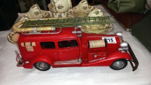 A large pressed steel and fibre glass model of a vintage American fire engine length 36cm