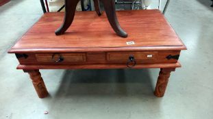 A rustic teak coffee table with iron fittings and 2 drawers COLLECT ONLY