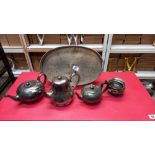 A silver plated tray, pewter teapots etc