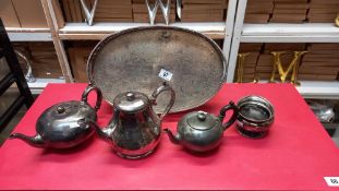 A silver plated tray, pewter teapots etc