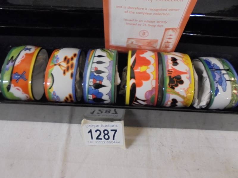 A boxed set of six Clarice Cliff napkin rings. - Image 2 of 3