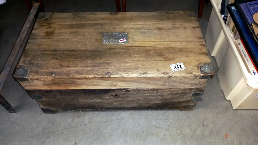 An antique oak box with copper corners & brass plaque