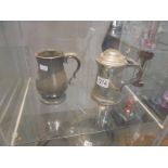 An antique pewter tankard stamped George Hotel and a lidded pewter tankard stamped Yates & Birch.