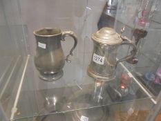 An antique pewter tankard stamped George Hotel and a lidded pewter tankard stamped Yates & Birch.