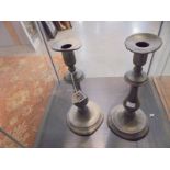 A pair of old pewter candlesticks, a/f.