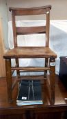 A 19/20c oak Chapel chair Collect Only